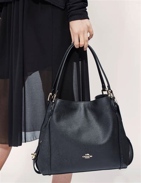 WOMEN'S LUXURY BLACK BAGS AND HANDBAGS .